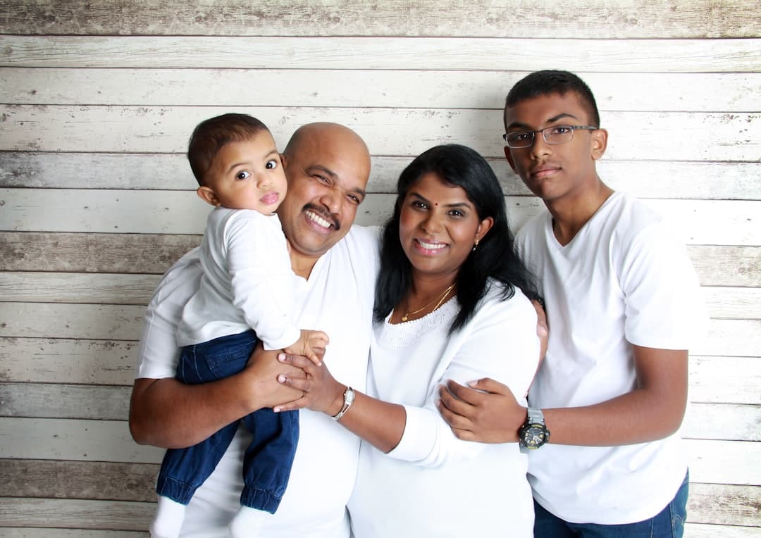 Smiling family outside NW Calgary dental clinic